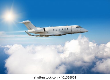 Private Jet Plane Flying Above Clouds