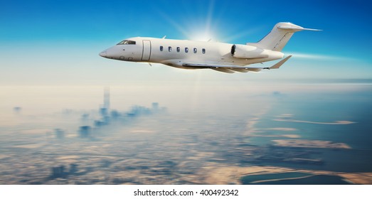 Private Jet Plane Flying Over Modern City