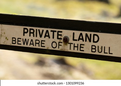 Private Land. Beware of the Bull sign on old gate, England
