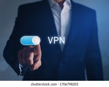 Private Network Security Concept.
Businessman Hand Tapping Button  On VPN. 