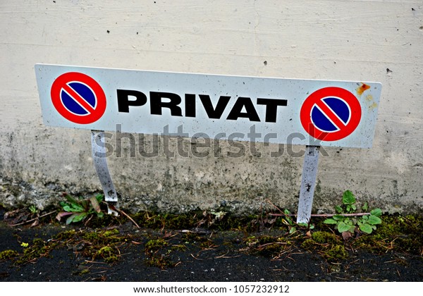 Private no parking sign\
on parking spot