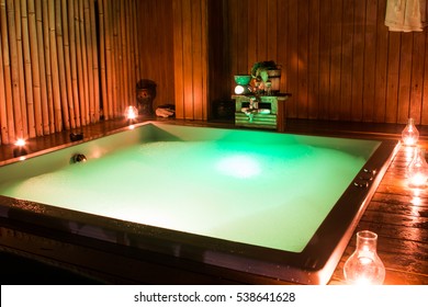 private romantic in jacuzzi in luxury health spa in resort. High ISO image. ambiental light only.