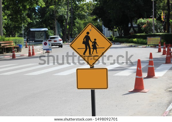 The private school encourages the parents  and\
students to walk at the crosswalk due to to be safe, Chiangmai -\
Thailand, 7 September 2019