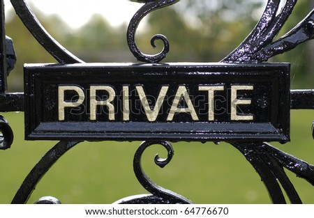 Private sign on old vintage black iron gate