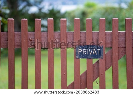 Private sign on the wooden fence in Austria, private ground - no trespassing, close up