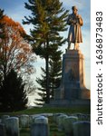 Private Soldier Monument at the Antietam National Cemetery in Sharpsburg, Maryland, USA with Headstoned in Foreground, Evening Light