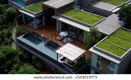 Private villa with an infinity pool on the coast of the island, drone view of a private expensive villa in Phuket