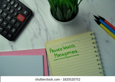 Private Wealth Management Write On A Book Isolated On Office Desk.