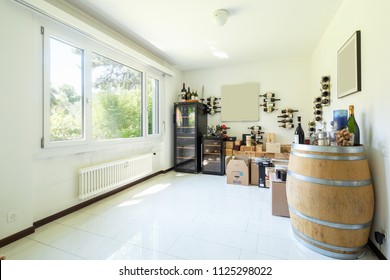 Private Wine Cellar With Many Wines, Boxes And Wooden Barrels. Nobody Inside