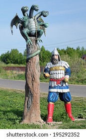 PRIVOLZHSKIY, RUSSIA - MAY 19, 2014: Sculpture Of A Russian Bogatyr With Zmey Gorynych (Slavic Dragon). Settlement Privolzhskiy, Former Gadovo Village, Considered As The Birthplace Of Zmey Gorynych.