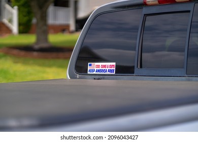 A Pro 2nd Amendment Sticker On The Back  Window Of A Pickup Truck