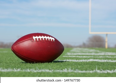 Pro American Football On The Field Close Up With The Goal Posts Beyond