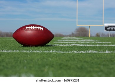 Pro American Football On The Field With Goal Posts Beyond