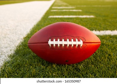 Pro American Football On The Field Close Up With Yard Lines Beyond