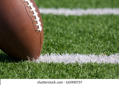 Pro American Football On The Field Close Up With Yard Lines Beyond