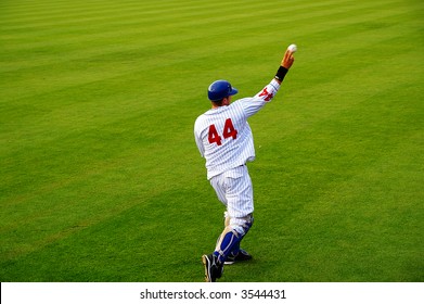 Pro Baseball  Player Throwing The Ball From The Field