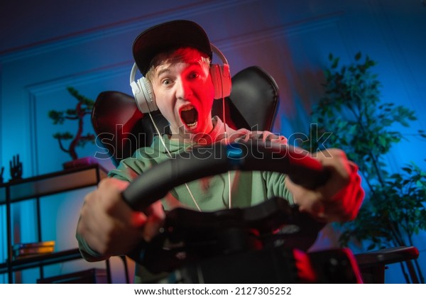 Pro Gamer Man playing computer games. Car Racing\
Online Video Game