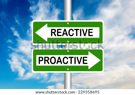 Proactive and reactive road signs with a blue sky in a background.  Choose your strategy 