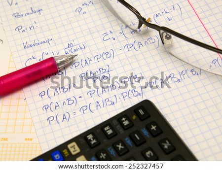 Probability exam, study set (hand writing notes, glasses, pencil and calculator