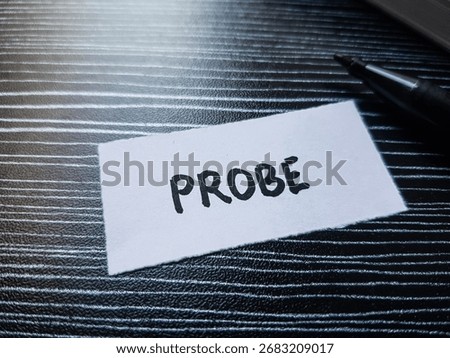 Probe writting on table background.