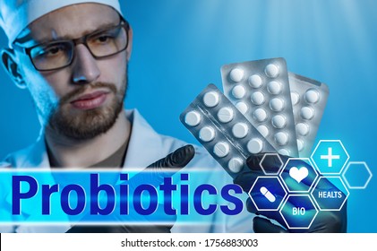 Probiotic. Doctor With Pills In His Hands On The Background Of The Inscription Probiotics. Drugs Contain Useful Bacteria. The Doctor Recommends Taking Probiotics.