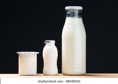 Probiotic Drinking Yogurt, Milk Bottle And Yogurt. Black Background