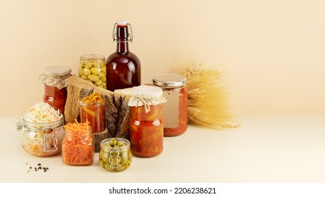 Probiotic Food. Pickled Or Fermented Products. Fermented Vegetables And Mushrooms In Glass Jars, Bottle With Home Made Beer And Copy Space. Home Food Preserving Or Canning. Preserving The Harvest 