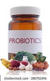 Probiotic (or Prebiotic) Rich Foods With A Medicine Pill Jar In The Background 