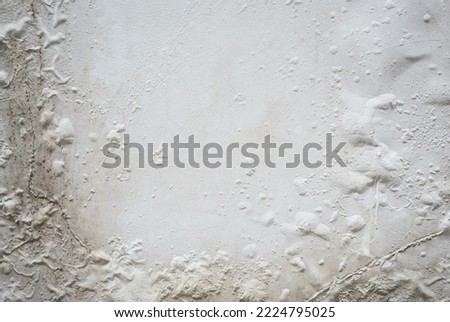 Problem of moisture damage acrylic white painting crack surface texture on exterior dirty stain concrete structure wall background by humidity.home repair old construction concept,renovation house.