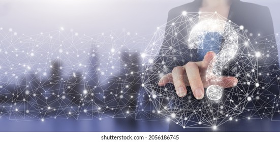 Problem, need of help and advice concept. Hand touch digital screen hologram question mark sign on city light blurred background. FAQ Concept image.Find answer online