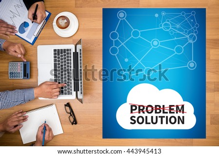 PROBLEM SOLUTION Business team hands at work with financial reports and a laptop