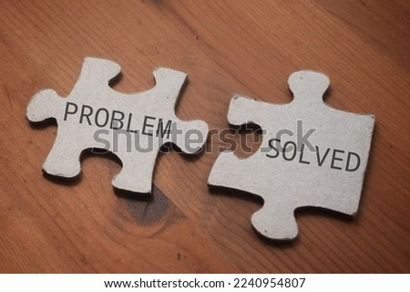 Problem Solved wording on a piece of puzzle. Business and education concept 