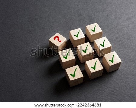 Problem solving, brainstorming or unknown factors in forecasting or malfunctions in business concept. Question mark symbol stands out from the check mark right symbols.