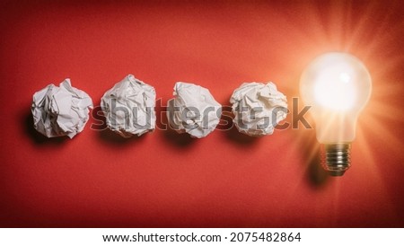 Problem solving concept - crumpled paper turns into glowing lightbulb