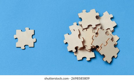 Problem Solving Concept: Single Unused Jigsaw Piece Beside a Pile of Parts