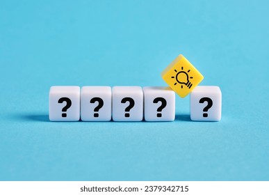 Problem solving. To find a creative business solution. Brainstorming and idea formation. Question mark and light bulb symbols on cubes. - Powered by Shutterstock