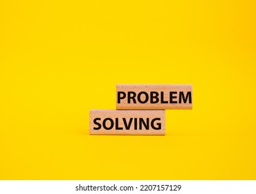 Problem solving symbol. Concept word Problem solving on wooden blocks. Beautiful yellow background. Business and concept. Copy space - Shutterstock ID 2207157129