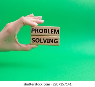 Problem solving symbol. Concept word Problem solving on wooden blocks. Beautiful green background. Businessman hand. Business and concept. Copy space - Shutterstock ID 2207157141