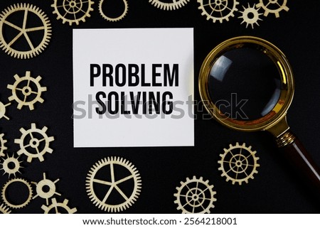 Problem Solving text with magnifying glass on black background