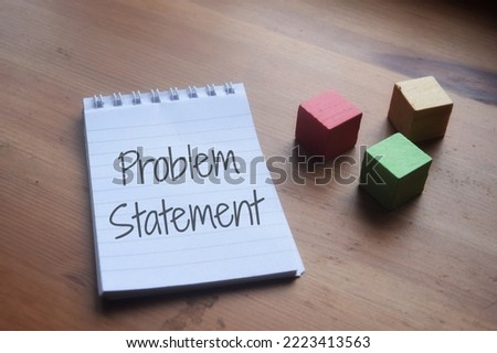 Problem Statement wording over a wooden table. Business and education concept 