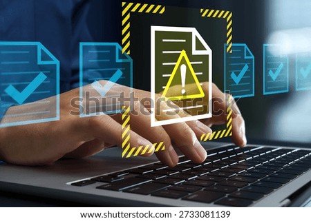 Problematic document and reject file. Error notification on approval system. Businessman using laptop computer to submit documents to compliance verification system.