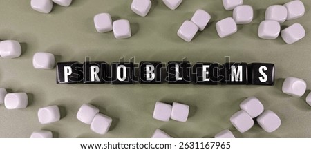 Problems Word on Black Dice Surrounded by Scattered White Dice, Concept of Challenge, Risk, Uncertainty, Business Issues, Crisis, and Strategic Decision. 
