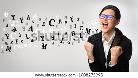 Problems at work concept. Portrait of angry businesswoman screaming, alphabet letters coming out of open mouth over light background