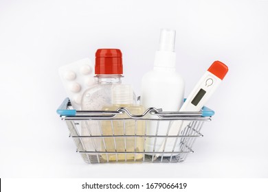 Procaution And Protection Shopping Set From COVID-19 In A Shopping  Cart Isolated. Consumer Buying Panic About Coronavirus.People Are Stocking Up Essentials For Home Quarantine.