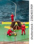 Procced disconnect towing wire to towing line or mooring line from Oil Rig after assist towed Rig Move by deck crew offshore vessel