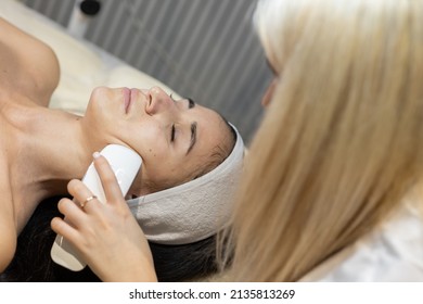 The procedure for cleaning and rejuvenating the skin of the face in the cosmetologist's office - Shutterstock ID 2135813269