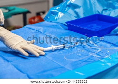 The procedure of inserting a double lumen catheter into a patient with cardiovascular occlusion in the hospital. Doctor insert double lumen catheter. insert guide wire. 