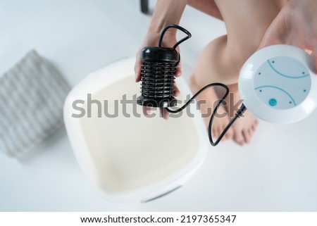 procedure of ionic detox foot bath machine in spa beauty center isolated