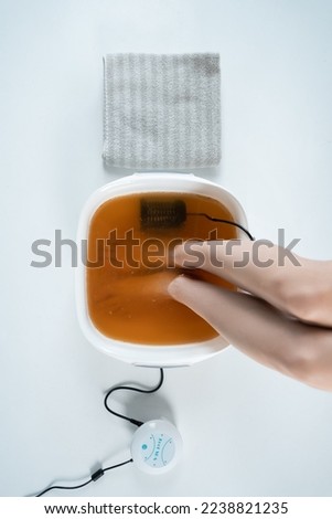 procedure of ionic detox foot bath machine in spa beauty center isolated