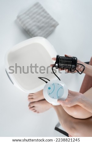 procedure of ionic detox foot bath machine in spa beauty center isolated